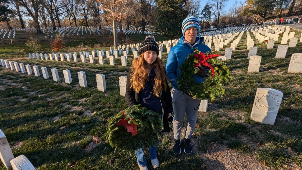 Kids preparing to lay wreaths